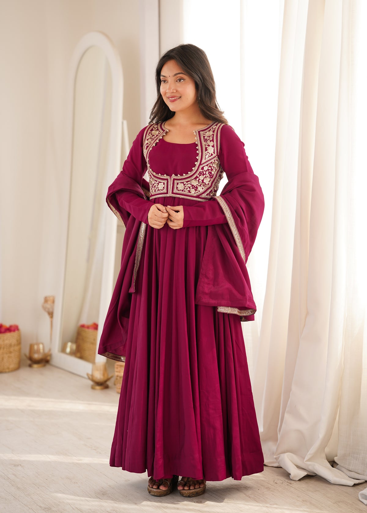 Rani pink Roman silk Anarkali gown featuring a flared silhouette and an intricately embroidered short jacket