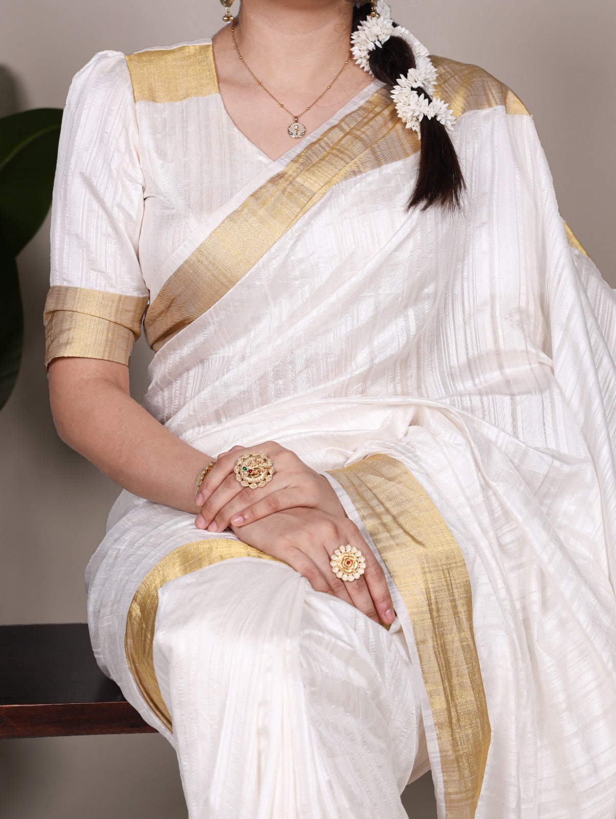 Dressing up for Onam in a raw silk saree that reflects the beauty of Kerala traditions and celebrations.