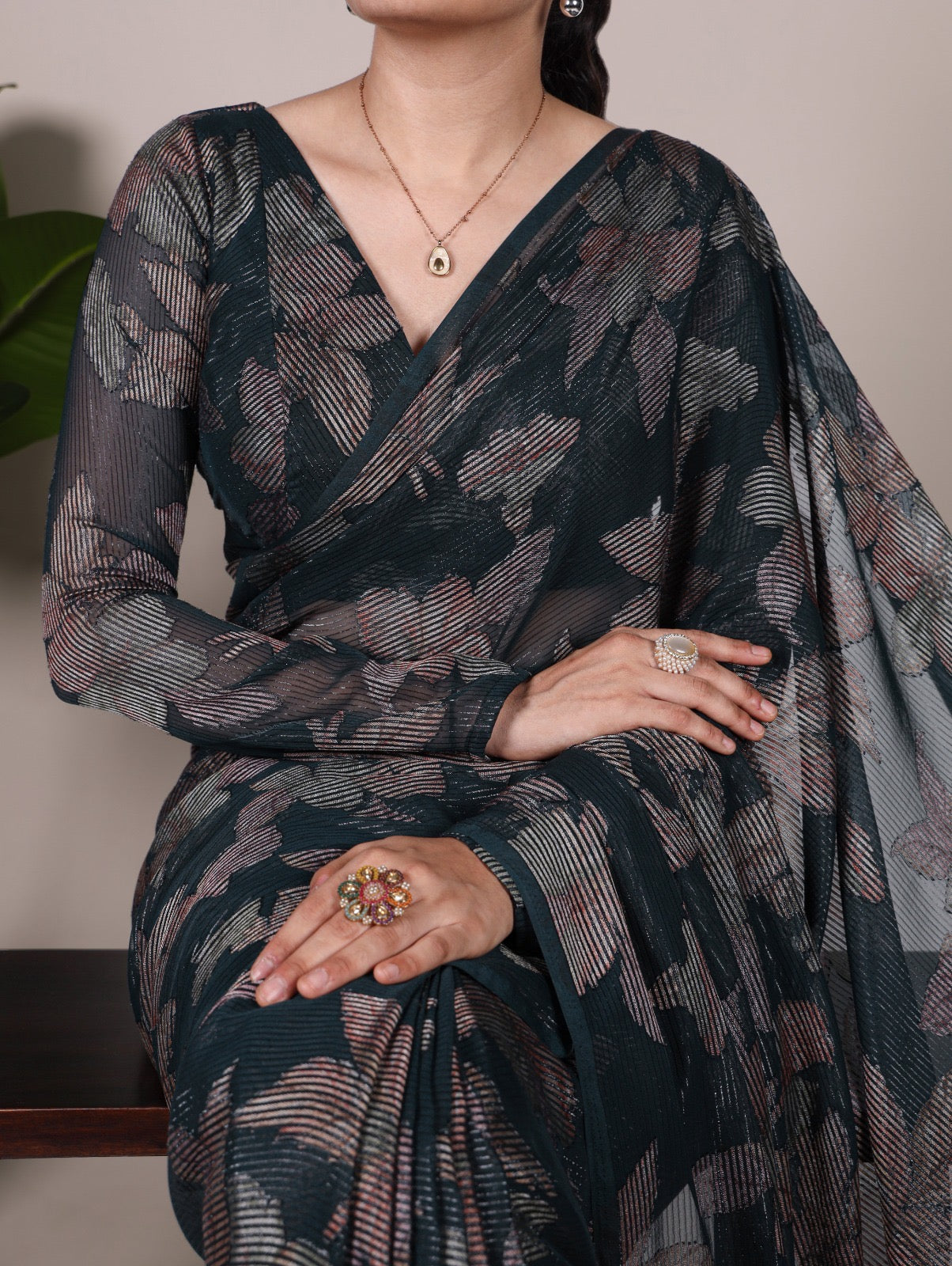 This floral Lurex Brasso saree blends the charm of blooming prints with the luxury of subtle shine 🍁
