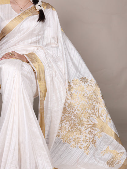 Dressing up for Onam in a raw silk saree that reflects the beauty of Kerala traditions and celebrations.