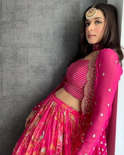 Vibrant pink floral-printed georgette lehenga choli paired with a matching sheer embroidered jacket