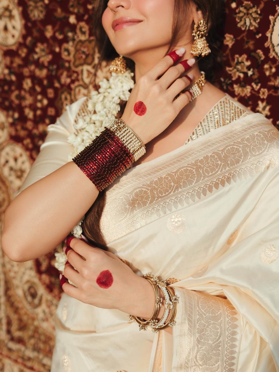 Diva of white banarasi silk saree