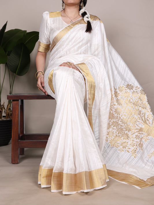 Dressing up for Onam in a raw silk saree that reflects the beauty of Kerala traditions and celebrations.
