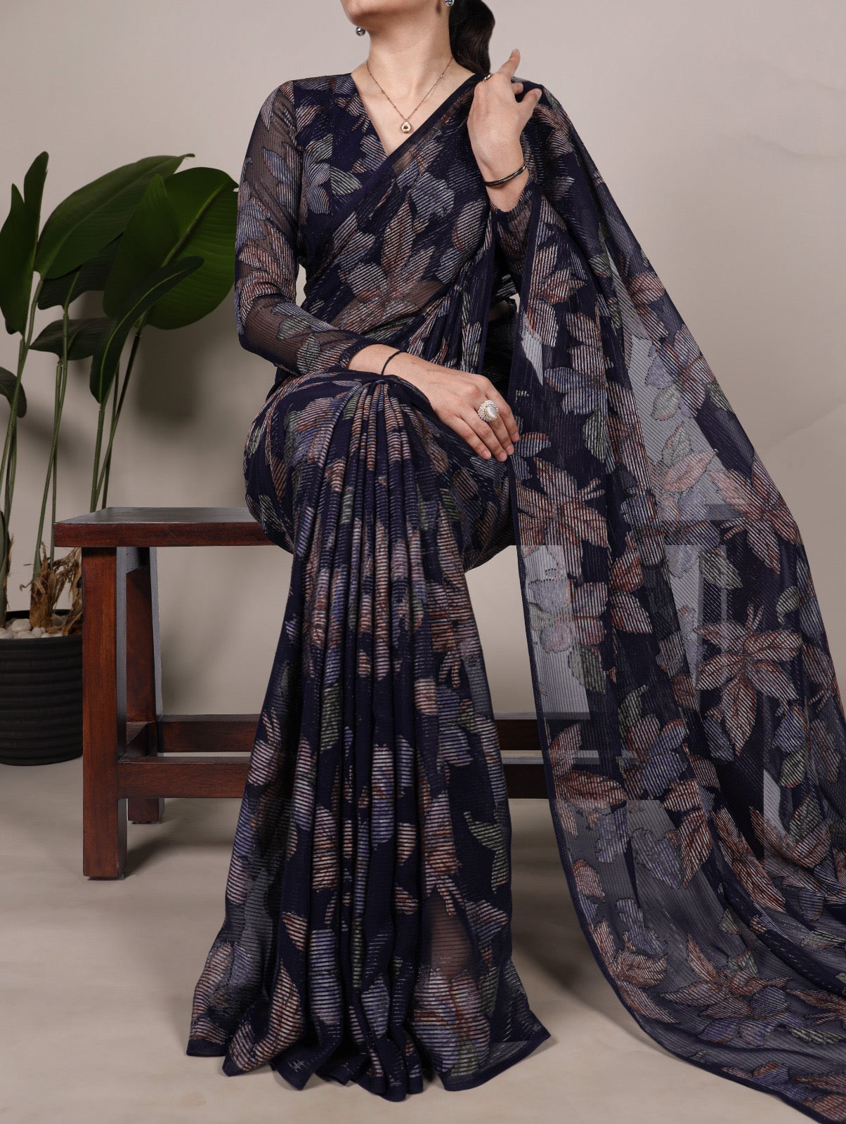This floral Lurex Brasso saree blends the charm of blooming prints with the luxury of subtle shine 🍁