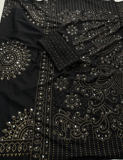 Black saree embellished with traditional Bandhani and circular motif prints and Real mirror Work