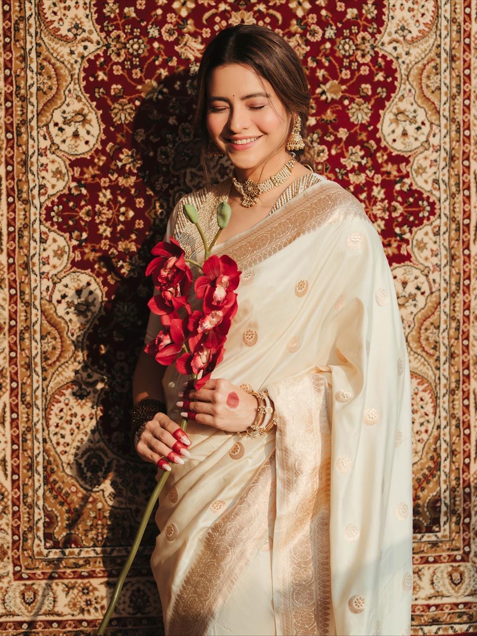 Diva of white banarasi silk saree