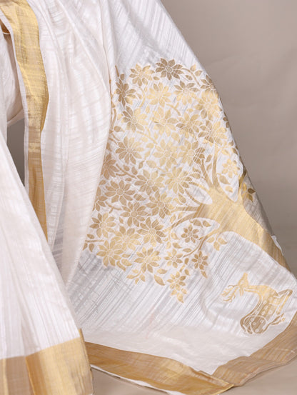 Dressing up for Onam in a raw silk saree that reflects the beauty of Kerala traditions and celebrations.