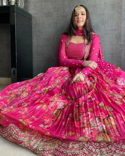Vibrant pink floral-printed georgette lehenga choli paired with a matching sheer embroidered jacket