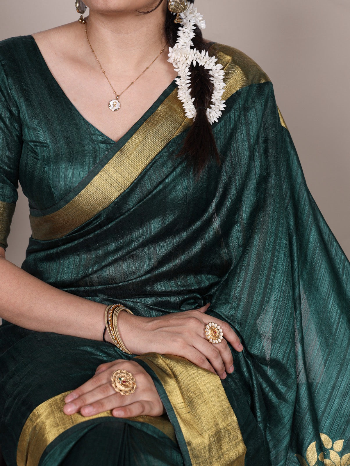 Dressing up for Onam in a raw silk saree that reflects the beauty of Kerala traditions and celebrations.