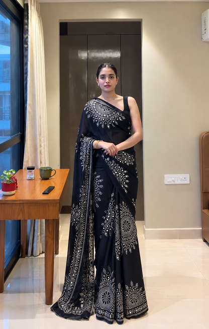 Black saree embellished with traditional Bandhani and circular motif prints and Real mirror Work