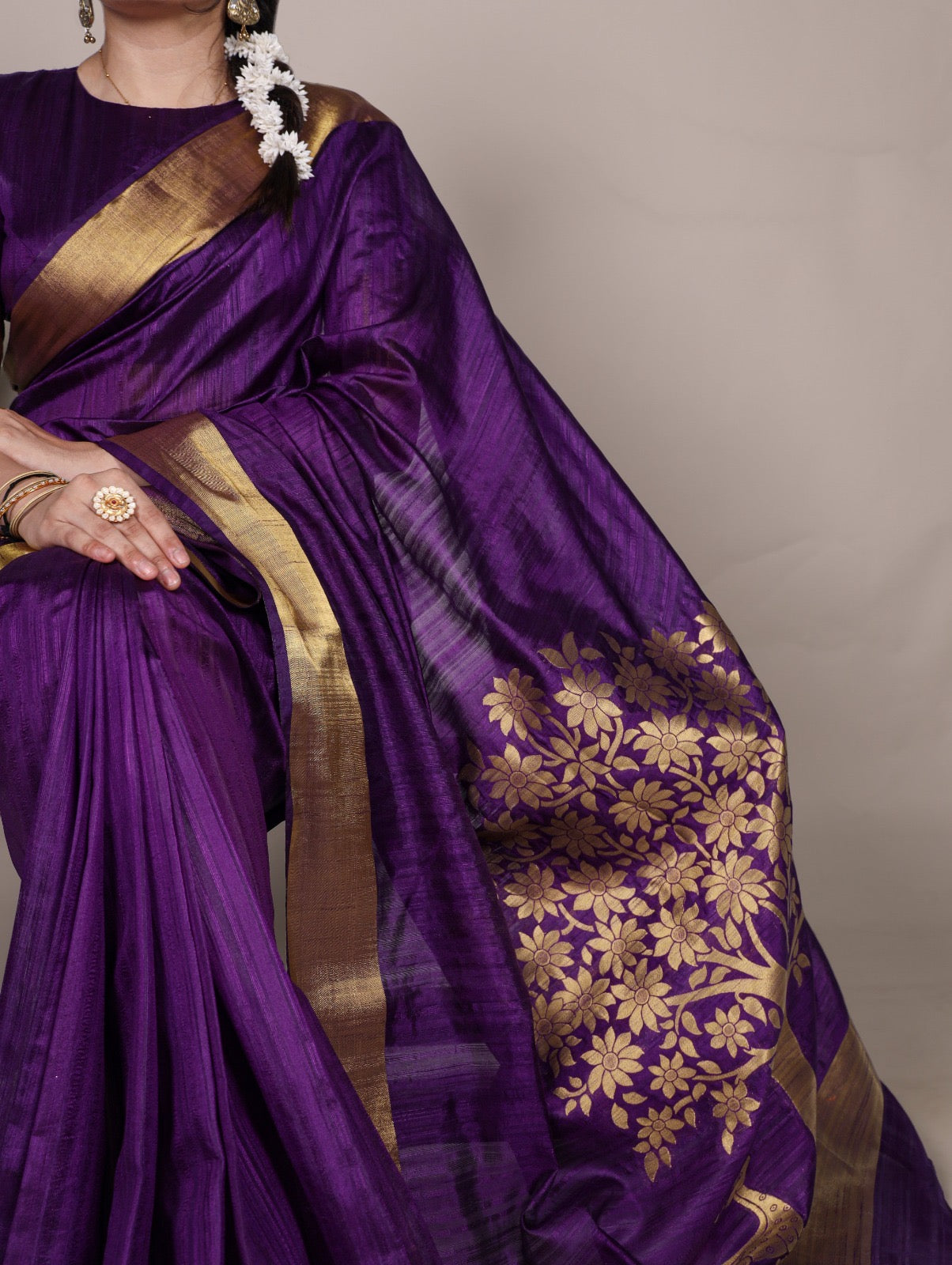 Dressing up for Onam in a raw silk saree that reflects the beauty of Kerala traditions and celebrations.