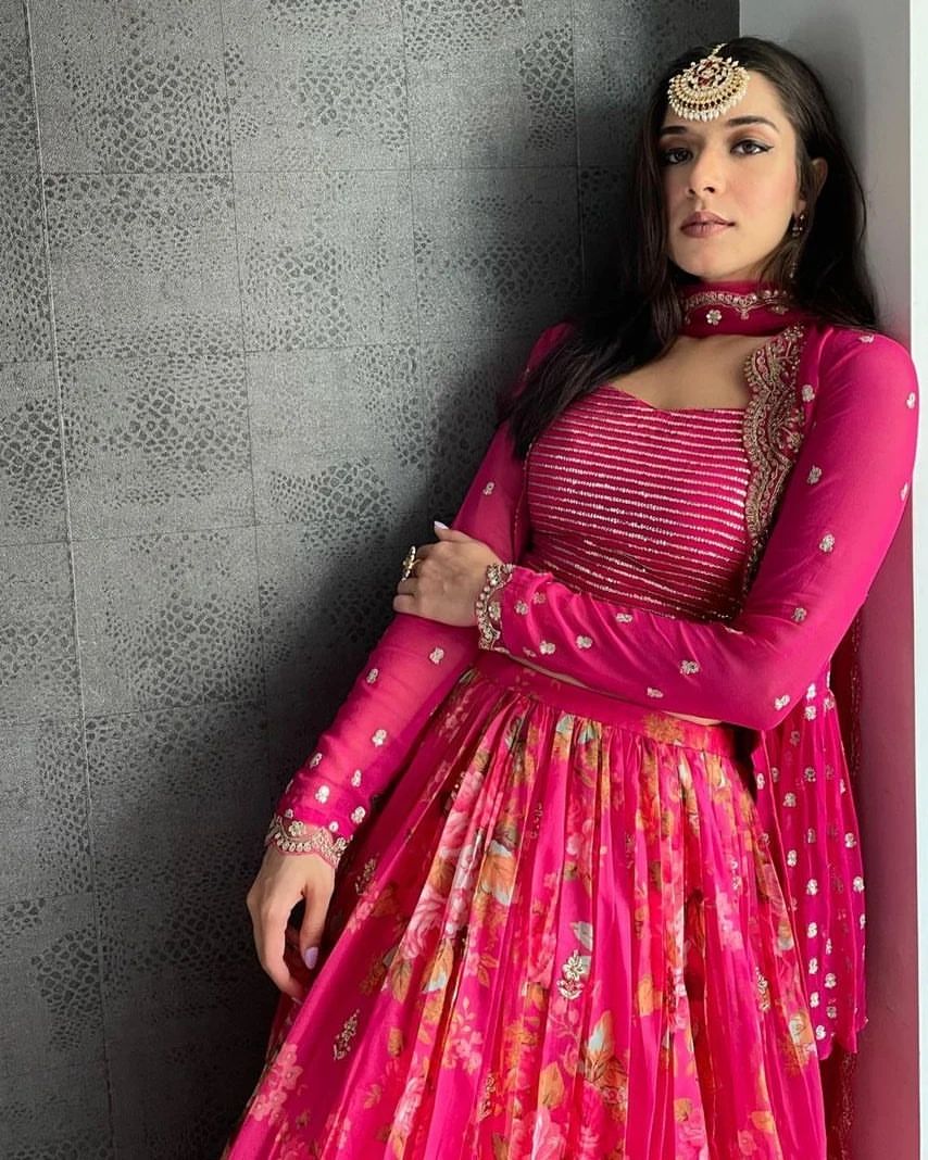 Vibrant pink floral-printed georgette lehenga choli paired with a matching sheer embroidered jacket