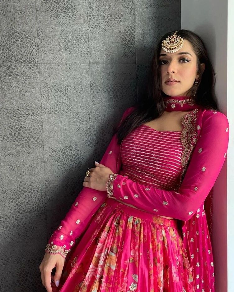 Vibrant pink floral-printed georgette lehenga choli paired with a matching sheer embroidered jacket