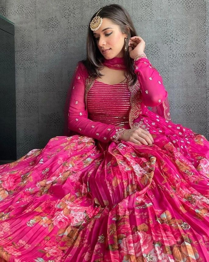 Vibrant pink floral-printed georgette lehenga choli paired with a matching sheer embroidered jacket