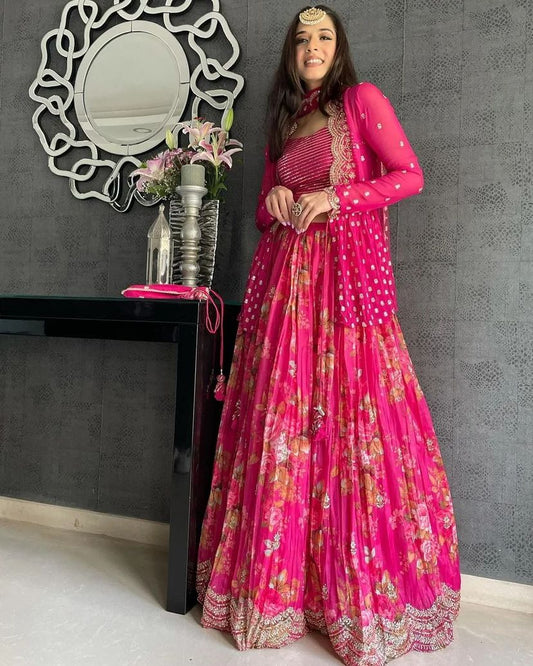 Vibrant pink floral-printed georgette lehenga choli paired with a matching sheer embroidered jacket