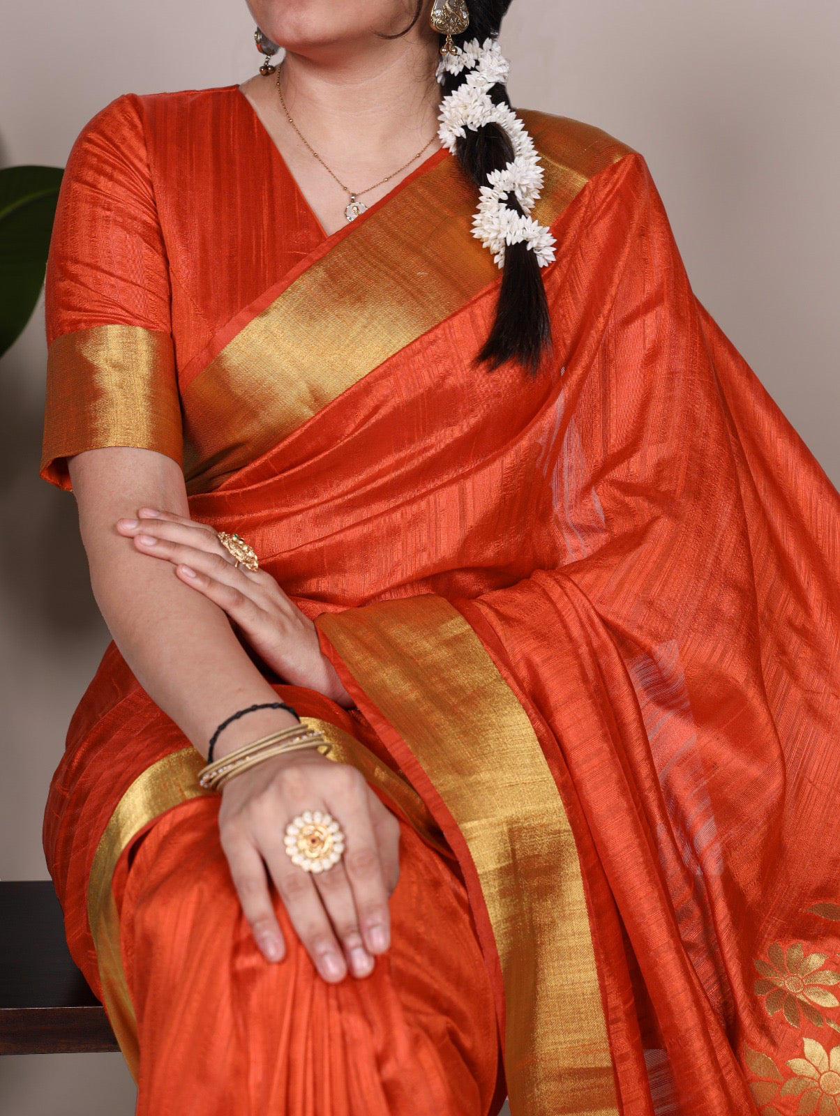 Dressing up for Onam in a raw silk saree that reflects the beauty of Kerala traditions and celebrations.