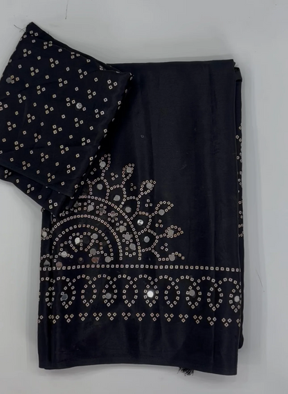 Black saree embellished with traditional Bandhani and circular motif prints and Real mirror Work