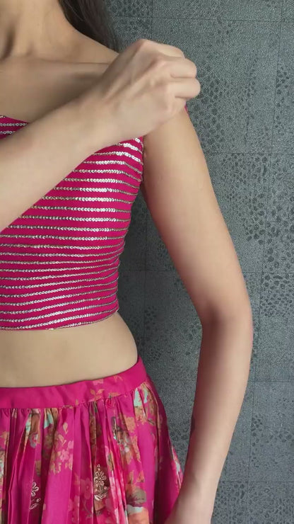 Vibrant pink floral-printed georgette lehenga choli paired with a matching sheer embroidered jacket